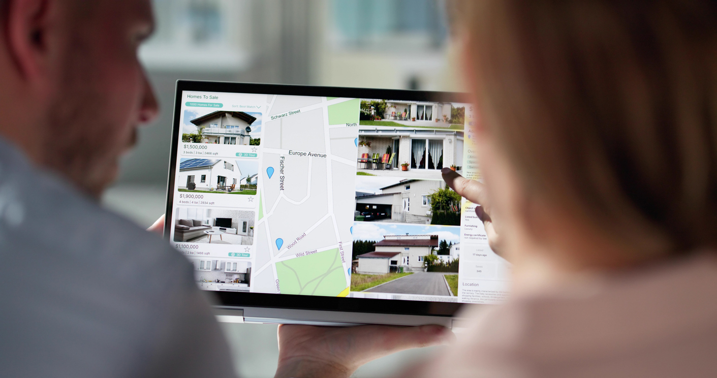 Couple searching for a home online