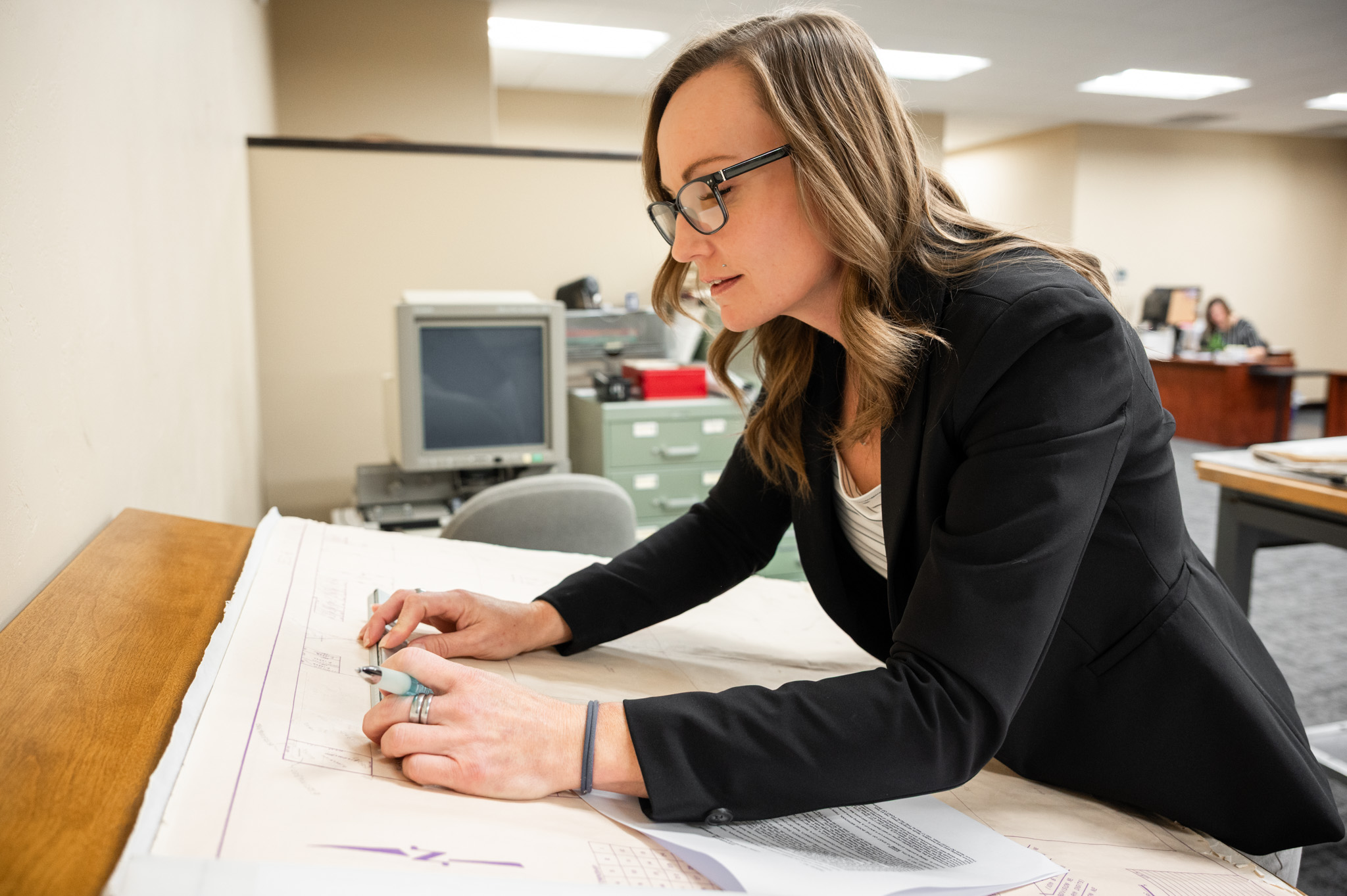 Title Officer Examining a Map